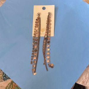 Woman’s gold earrings